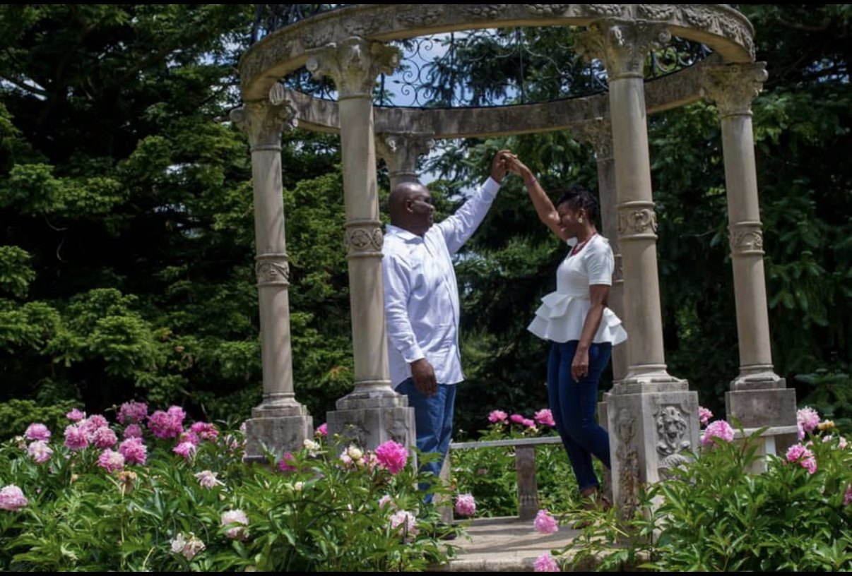 Couple photographed in a garden setting